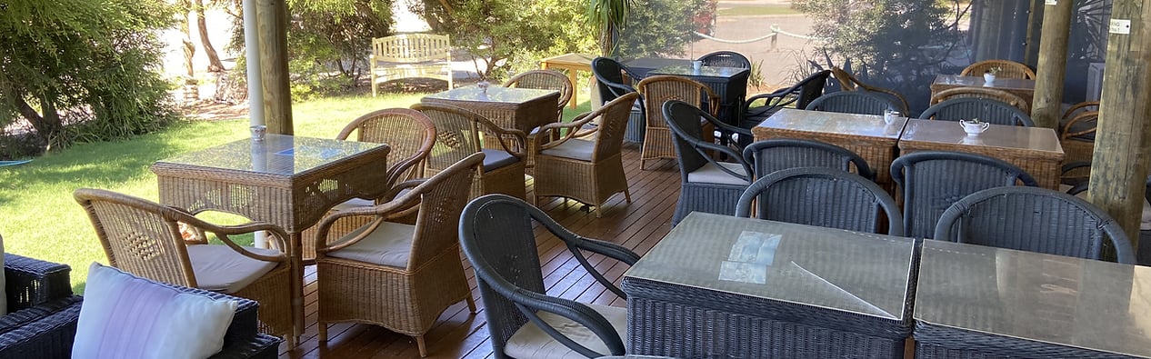 Shaded outdoor dining patio at Centre Break Beach Stay