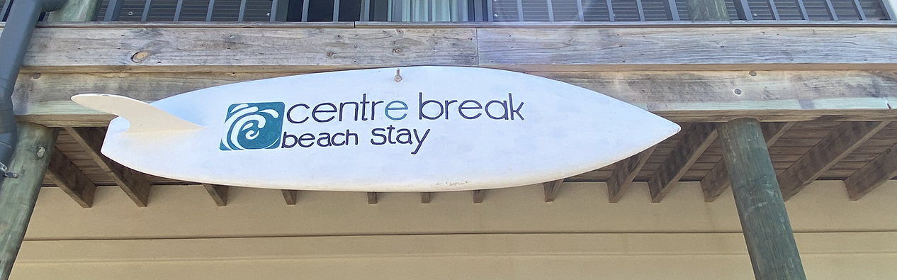 Centre Break Beach Stay sign mounted on the property exterior